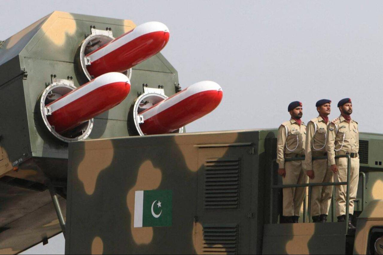 Pakistani army soldiers stand atop a military vehicle carrying missiles Babur during the Pakistan Day parade in Islamabad on March 23, 2022. (AFP Photo)
