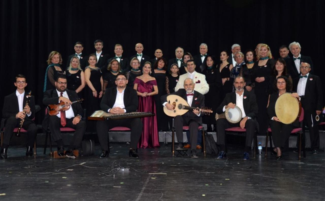 Members of Bursa Turk Musikisi Cemiyeti pose on stage with instrumentalists during a performance, Bursa, Türkiye, Dec. 29, 2025. (Photo via Facebook / Bursa Türk Musikisi Cemiyeti)