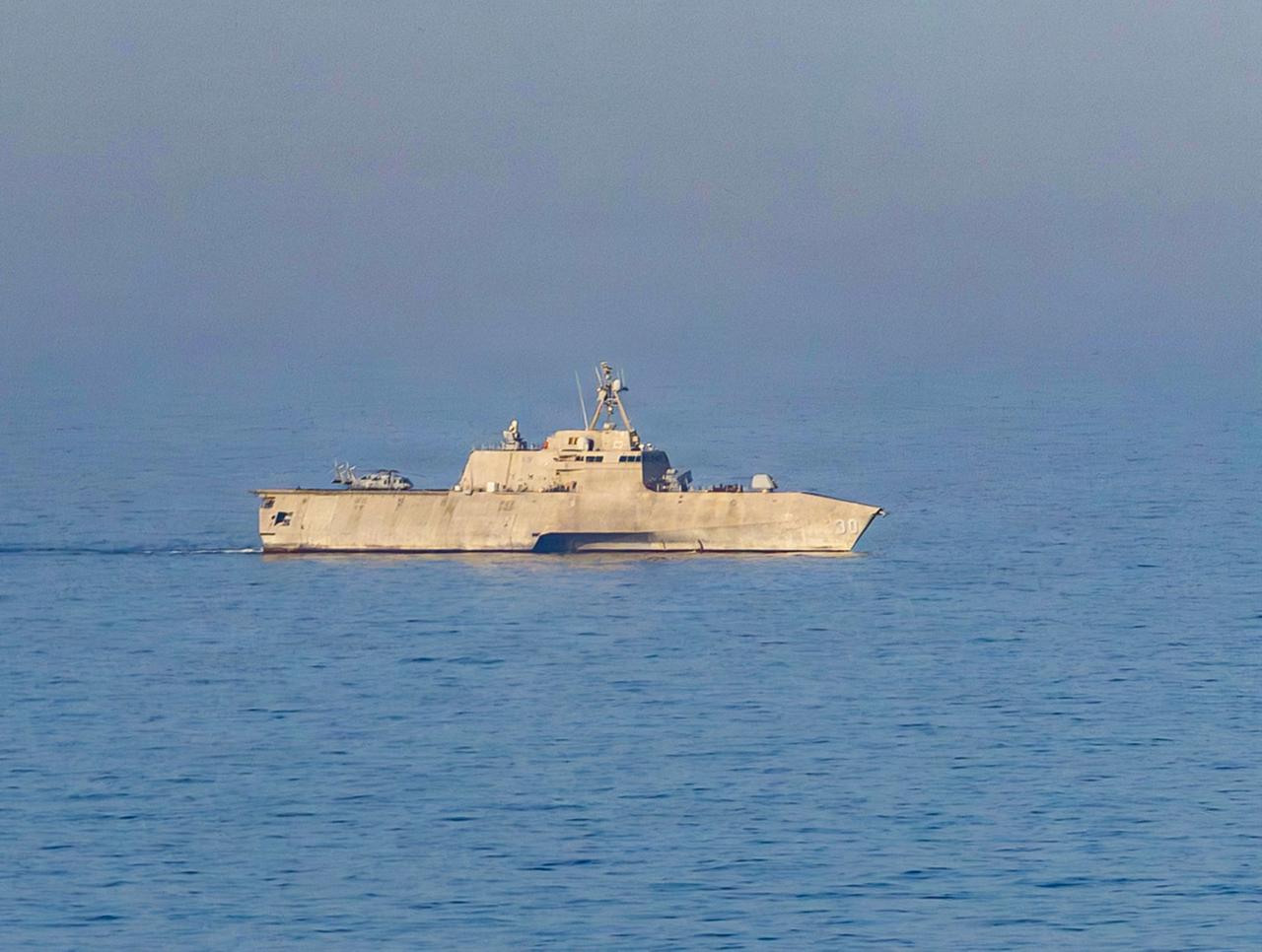 The Independence-class littoral combat ship USS Canberra (LCS 30) patrols the Arabian Sea during a maritime blockade against ships entering or exiting Iranian ports and coastal areas, April 17, 2026. (Photo via U.S. Navy)