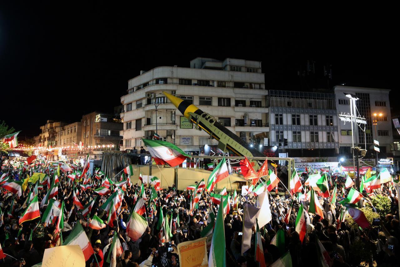 People gather at Enghelab and Vanak squares to participate in anti-US and anti-Israel demonstrations, waving Iranian flags and chanting slogans on April 21, 2026 in Tehran, Iran. (AA Photo)