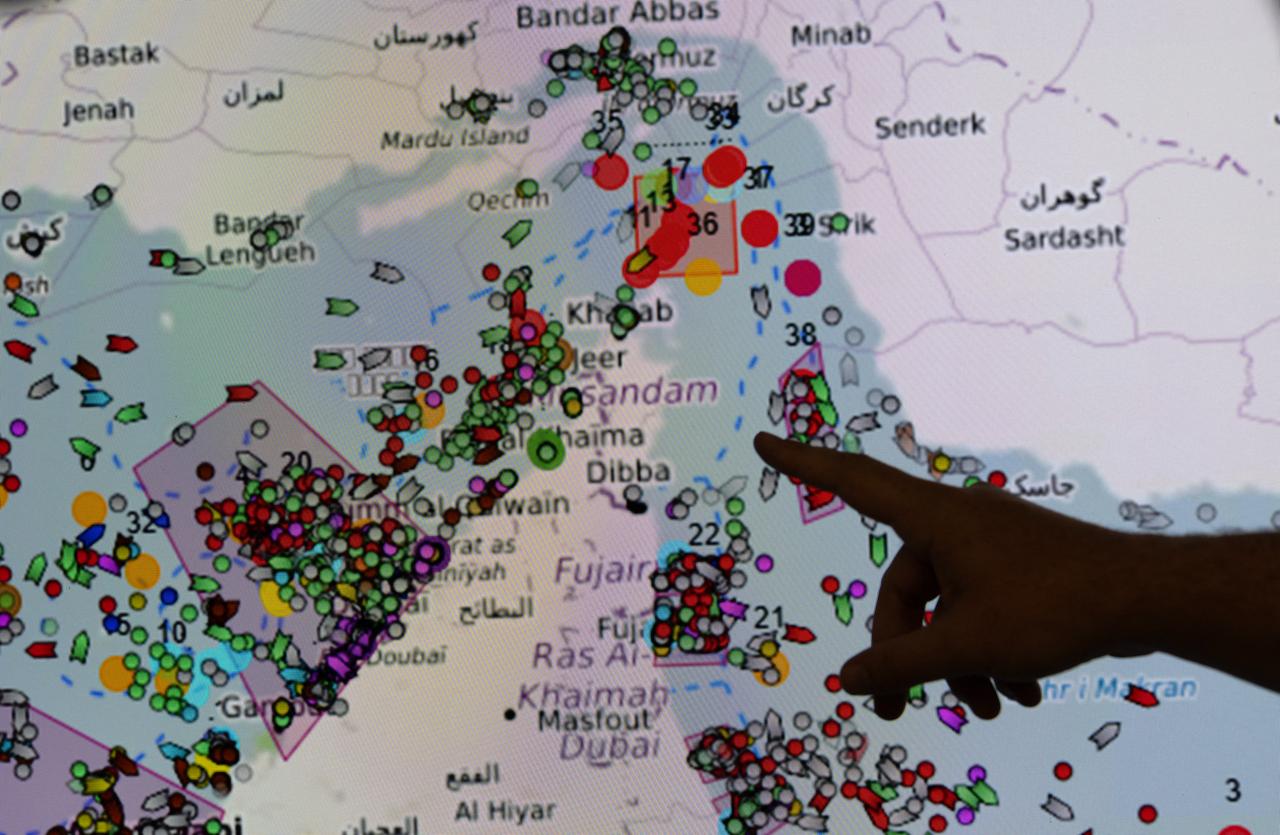 A person points towards the positions of ships on the Strait of Hormuz on a screen at the MICA center (Maritime Information and Cooperation and Awareness) in Brest, western France, April 27, 2026. (AFP Photo)