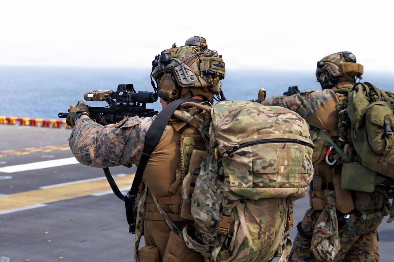 U.S. Marines fire rifles during a deck shoot aboard the forward-deployed amphibious assault ship USS Tripoli (LHA 7), in the CENTCOM area of responsibility during Operation Epic Fury, April 2, 2026. (Photo via U.S. Marine Corps)