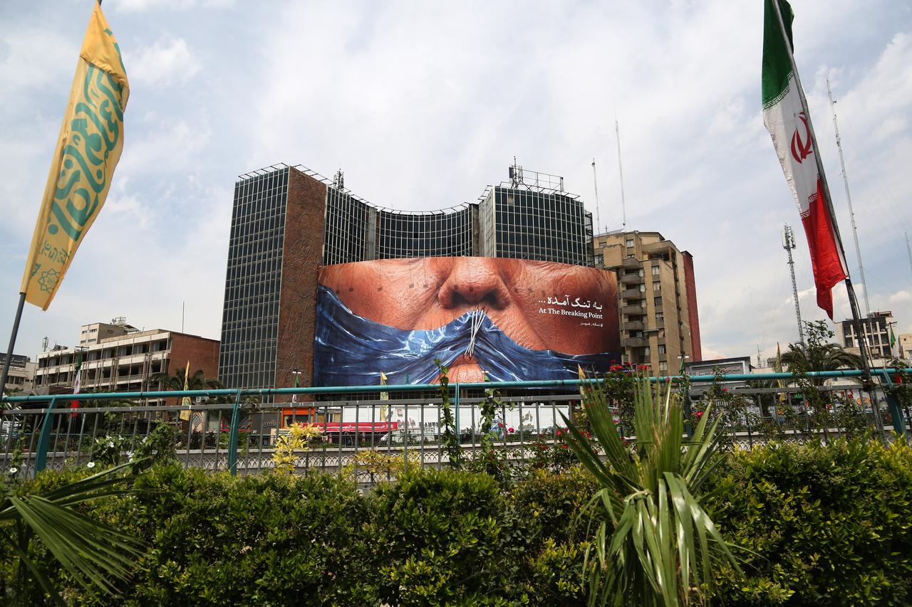 A giant banner depicting the Strait of Hormuz is displayed at Vali-e Asr Square, featuring the phrase “At the breaking point" as tensions continue between Iran and United States in Tehran, Iran, May 02, 2026.  (AA Photo)
