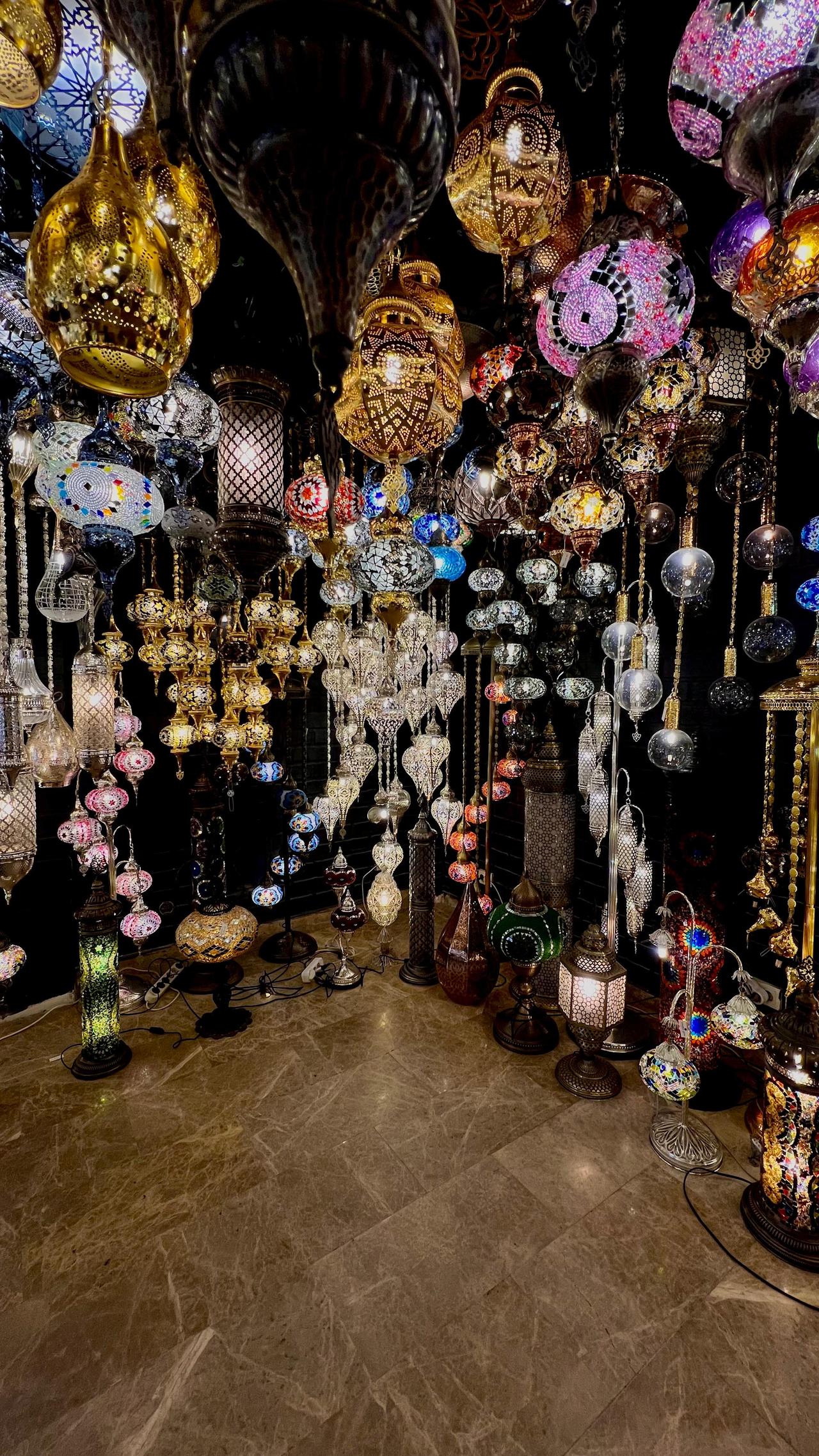 Displaying a variety of mosaic lamps in different shapes, sizes, and colors inside the Istanbullamps shop at the Grand Bazaar. (Photo by Türkiye Today)