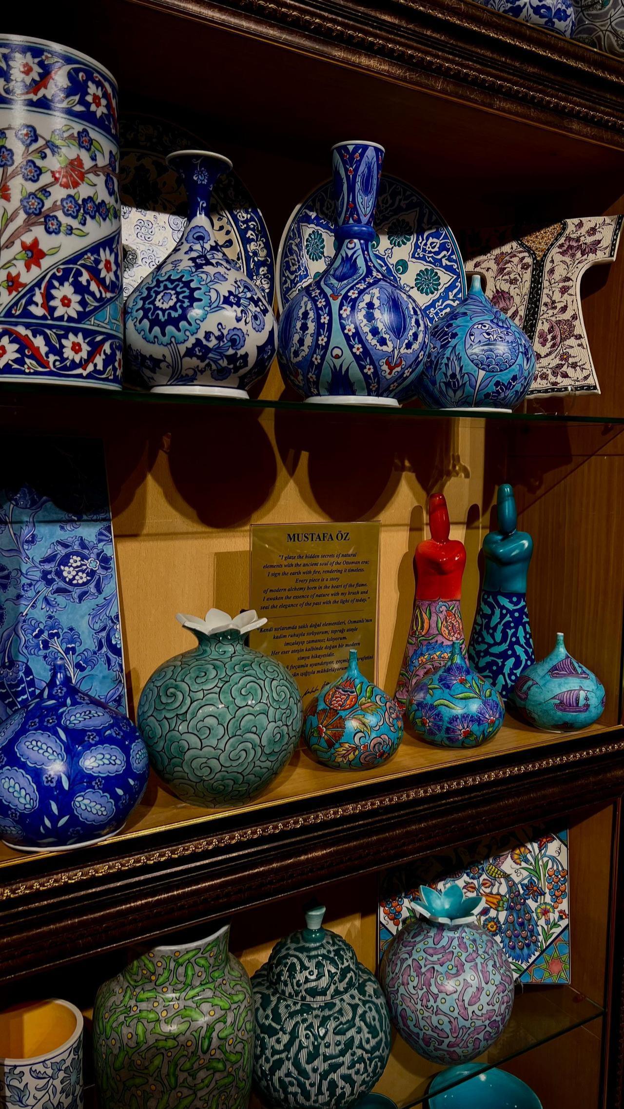 A display of ceramic pieces from the “ Matte Glaze” collection by artisan Mustafa Öz, with his signature visible among the works. (Photo by Türkiye Today)