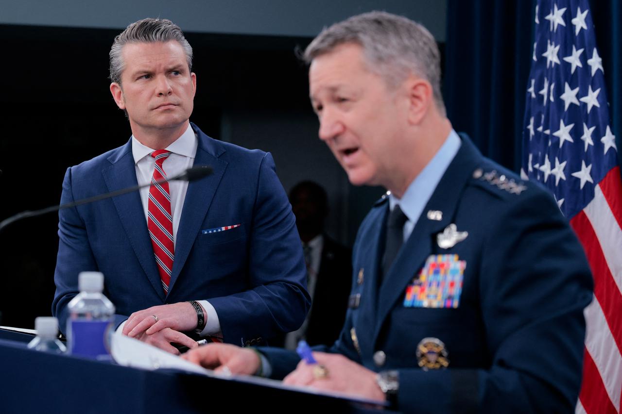 U.S. Secretary of War Pete Hegseth (L) looks on as Chairman of the Joint Chiefs of Staff Gen. Dan Caine speaks during a press briefing at the Pentagon on May 5, 2026 in Arlington, Virginia. (AFP Photo)