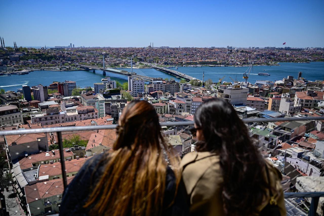 People watch the view of the Golden Horn and surrounding neighborhoods from an observation point in Istanbul, Türkiye, April 27, 2026. (AA Photo)