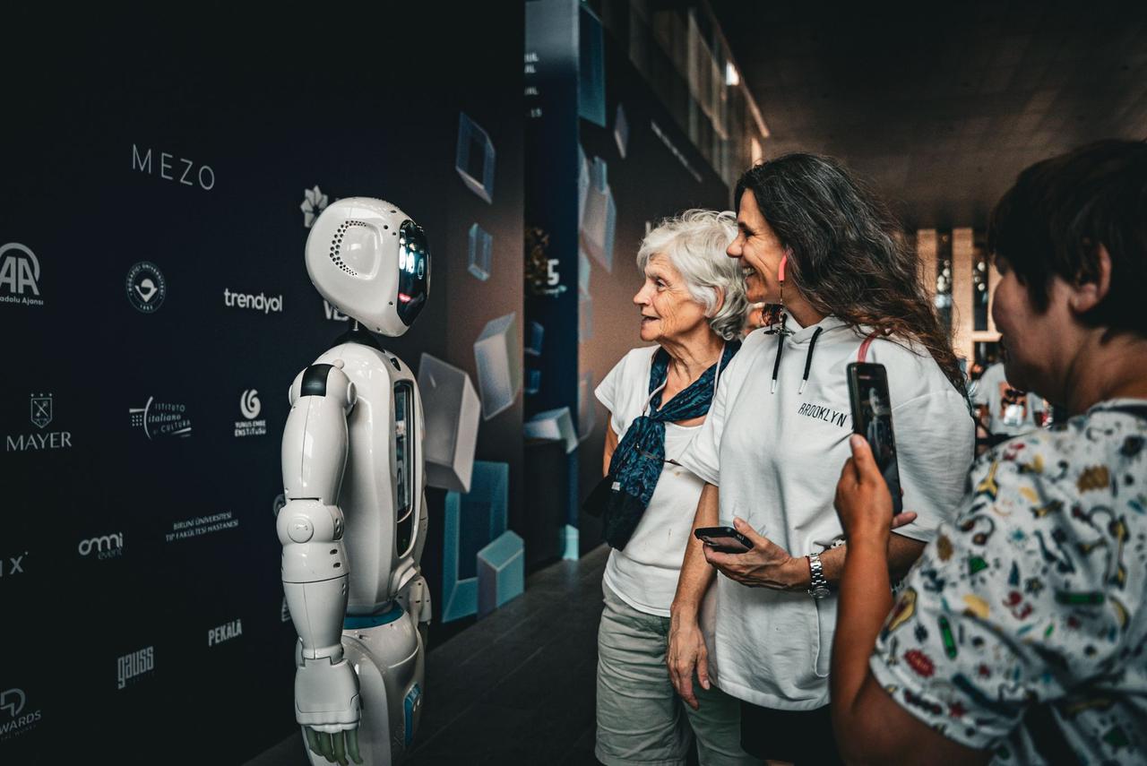 A humanoid robot interacts with visitors as attendees explore digital exhibits at a past Istanbul Digital Art Festival in Istanbul, Türkiye. (AA Photo)
