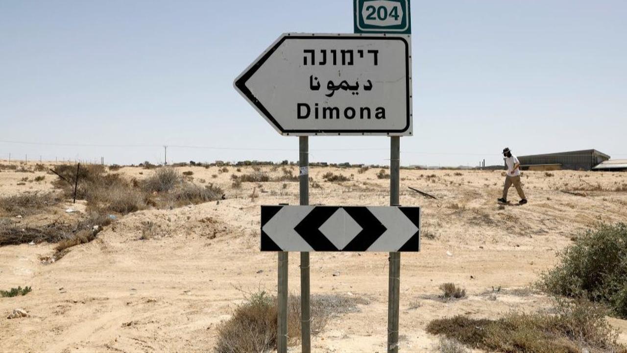 This picture, taken on April 22, 2021, shows a road sign pointing towards the Dimona nuclear power plant in the southern Israeli Negev Desert. (AFP Photo)