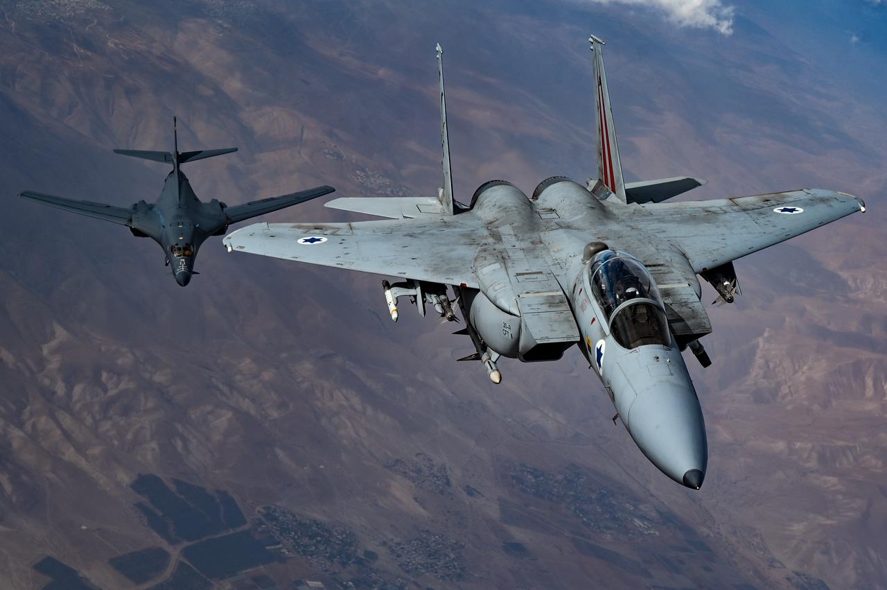 An Israeli Air Force F-15 Strike Eagle moves into formation with a U.S. Air Force B-1B Lancer over the Mediterranean Coast on Oct. 30, 2021. (Photo via U.S. Air Force)