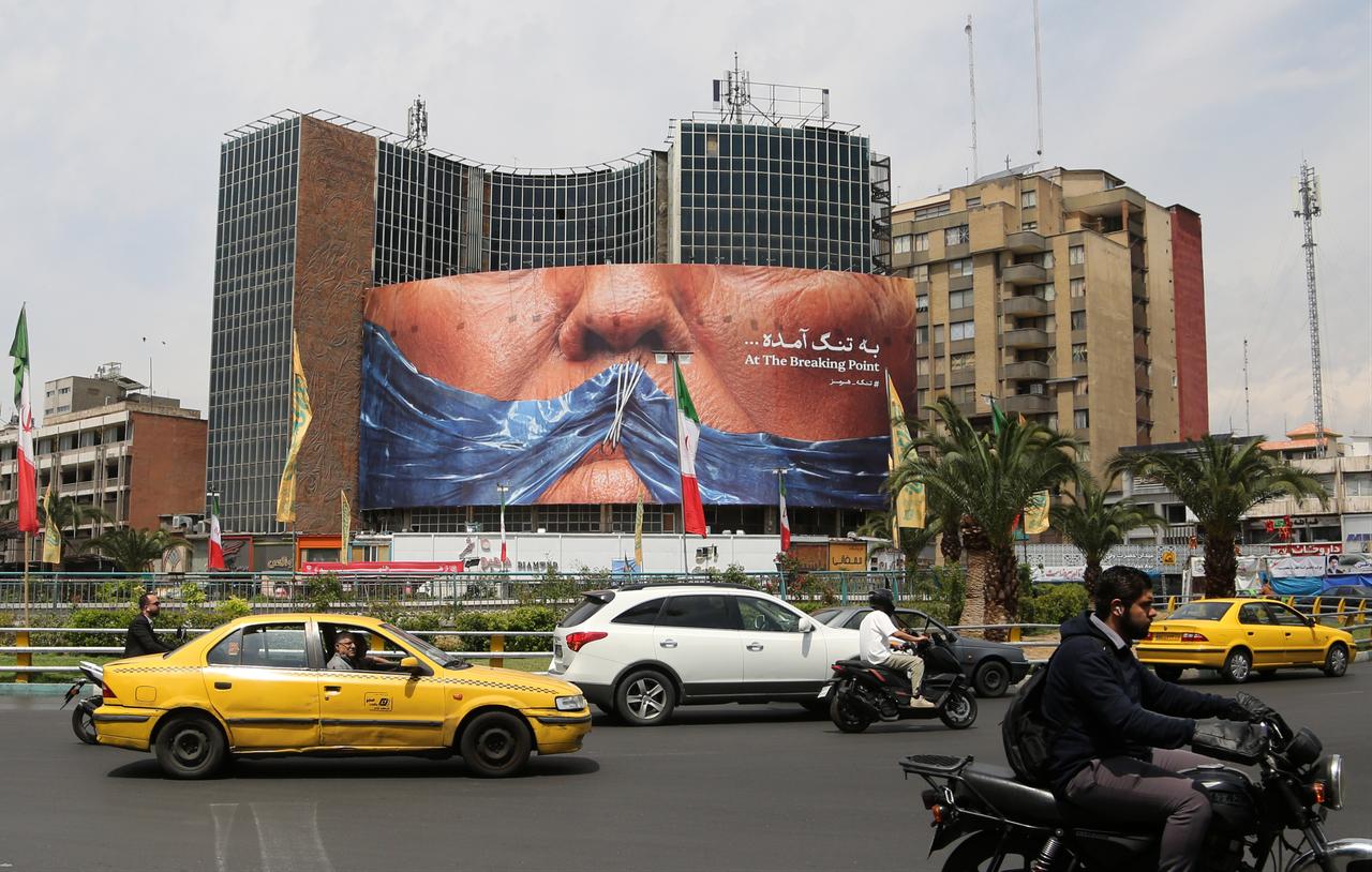 A giant banner depicting the Strait of Hormuz is displayed at Vali-e Asr Square, featuring the phrase “At the breaking point" as tensions continue between Iran and United States in Tehran, Iran, May 02, 2026.  (AA Photo)