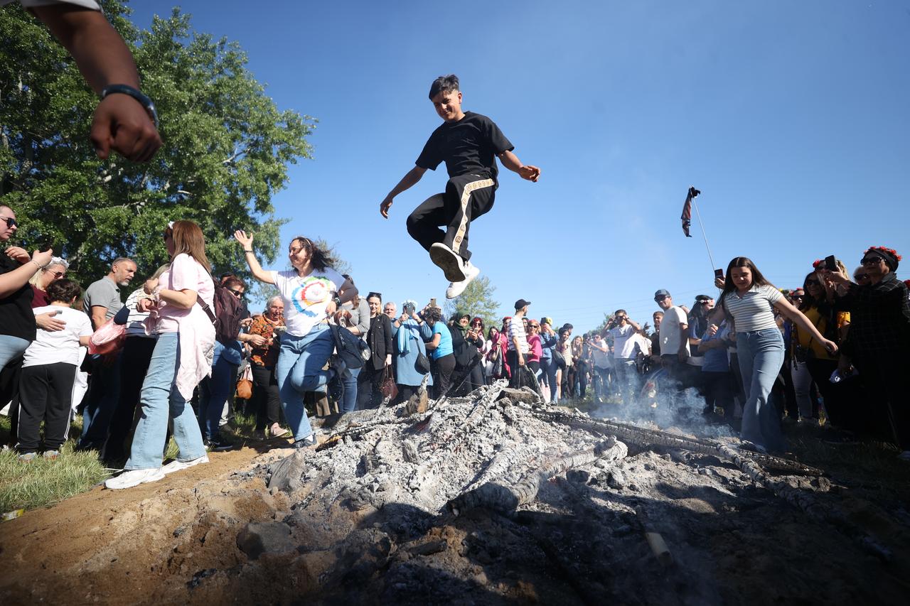 People jump over the Kakava bonfire during Kakava-Hidirellez Festival celebrations in Edirne, Türkiye, May 5, 2026. (AA Photo)