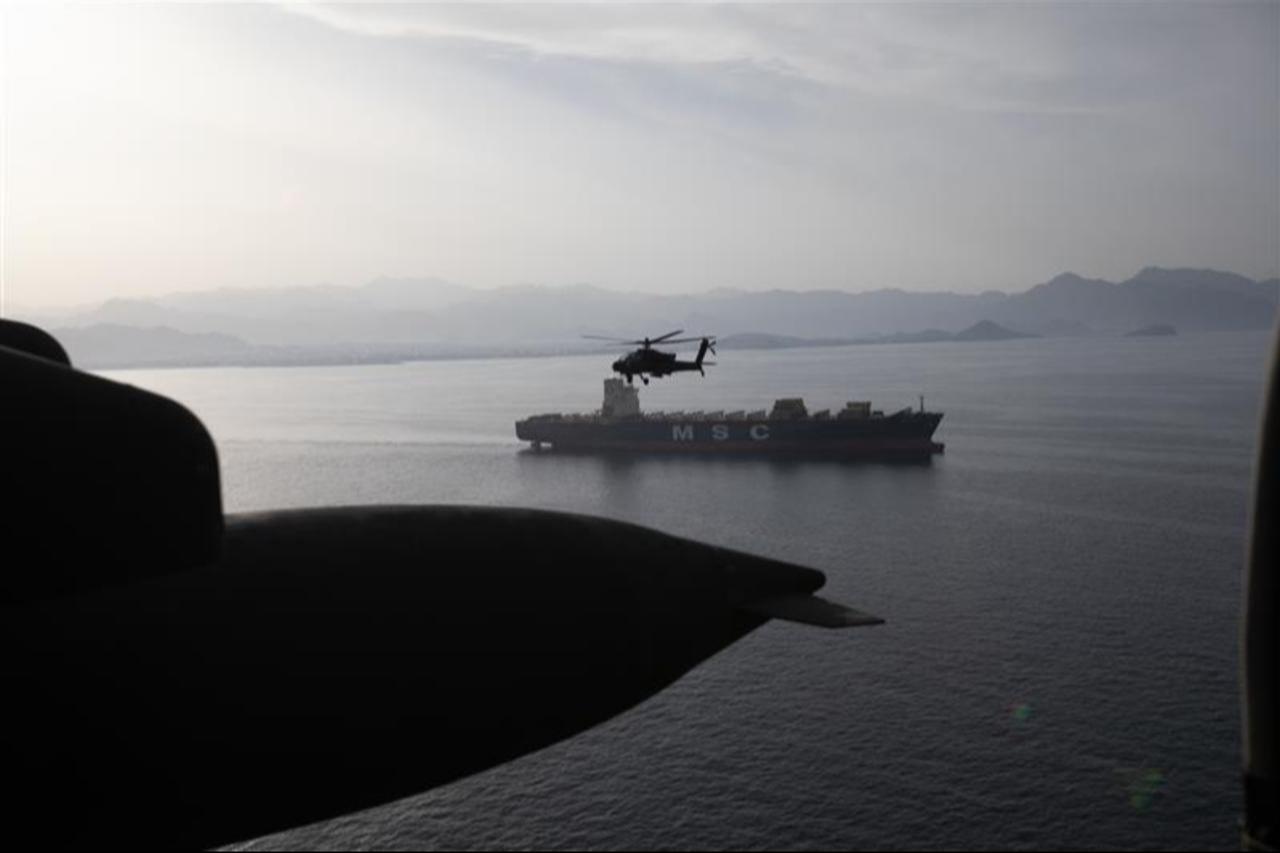 US Army AH-64 Apaches fly above the Strait of Hormuz during a patrol, on April 17, 2026. (Photo via X/@CENTCOM)