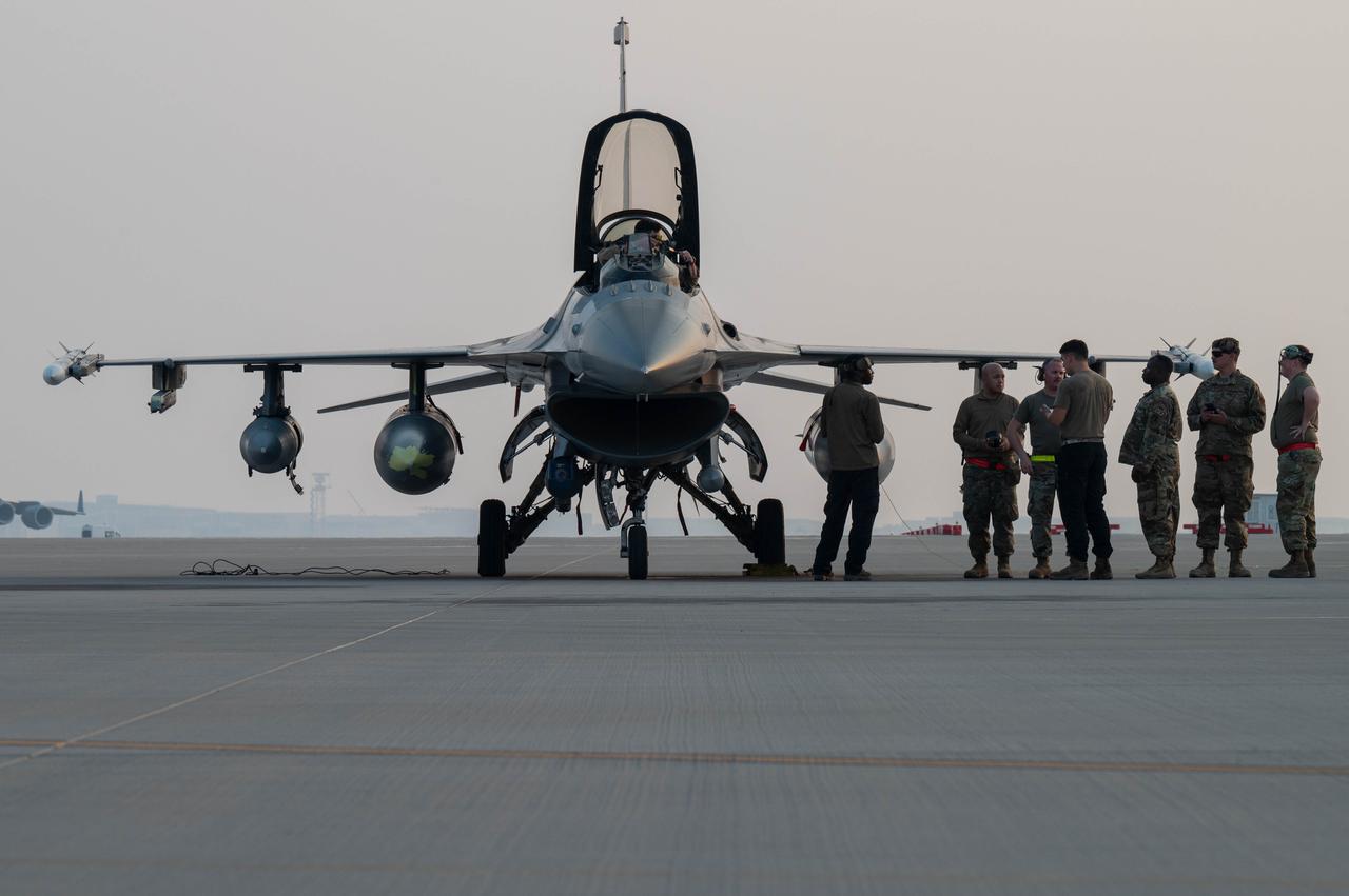 U.S. Air Force Airmen prepare an F-16 Fighting Falcon from Prince Sultan Air Base, Saudi Arabia, for an aircraft-to-aircraft ground refueling at Al Udeid Air Base, Qatar, Dec. 27, 2022. (Photo via U.S. Air Force)