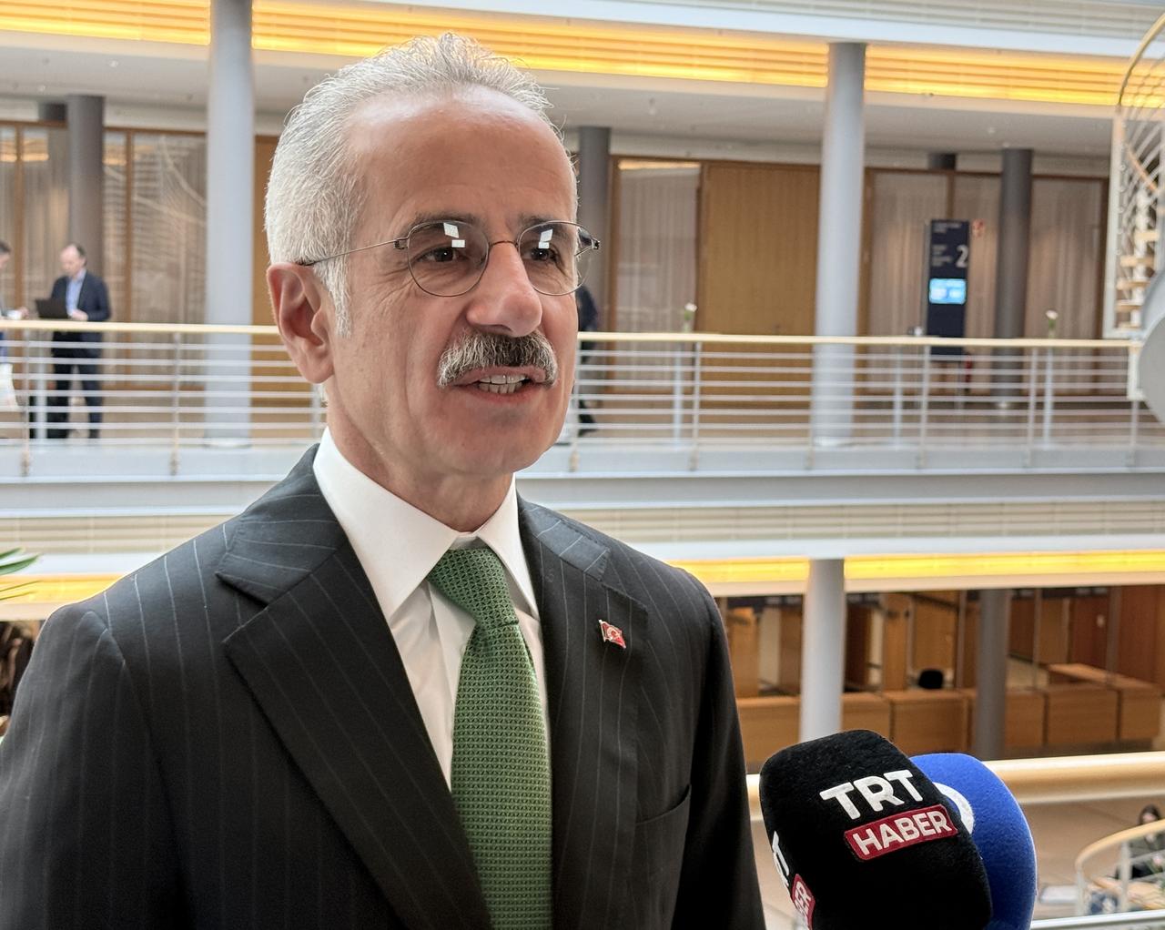Transport and Infrastructure Minister Abdulkadir Uraloglu speaks to reporters during the International Transport Forum summit in Leipzig, Germany, May 7, 2026. (AA Photo)