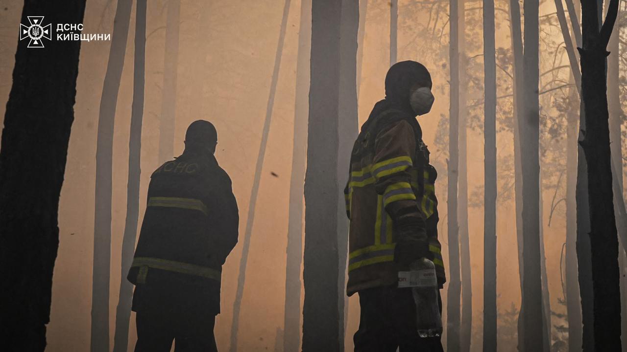This handout photograph taken on May 7, 2026 and released by the State Emergency Service of Ukraine on May 8, 2026, shows firefighters extinguishing a forest fire in the Chernobyl Exclusion Zone in northern Ukraine. (AFP Photo)