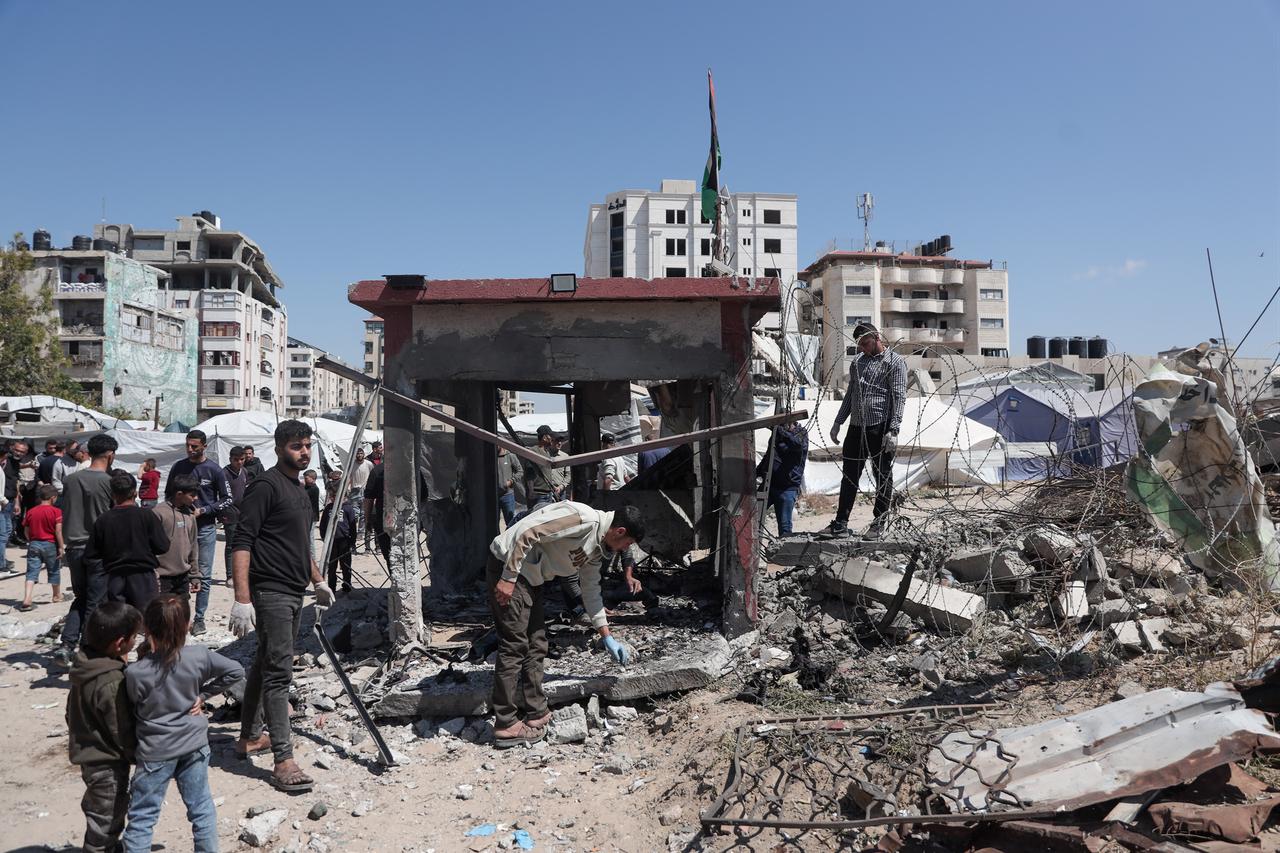Locals inspect the control point belonging to security forces, after it was hit by Israeli bomb attack that killed at least 2 and injured others in Gaza City, Gaza, Palestine on May 07, 2026. (AA Photo)