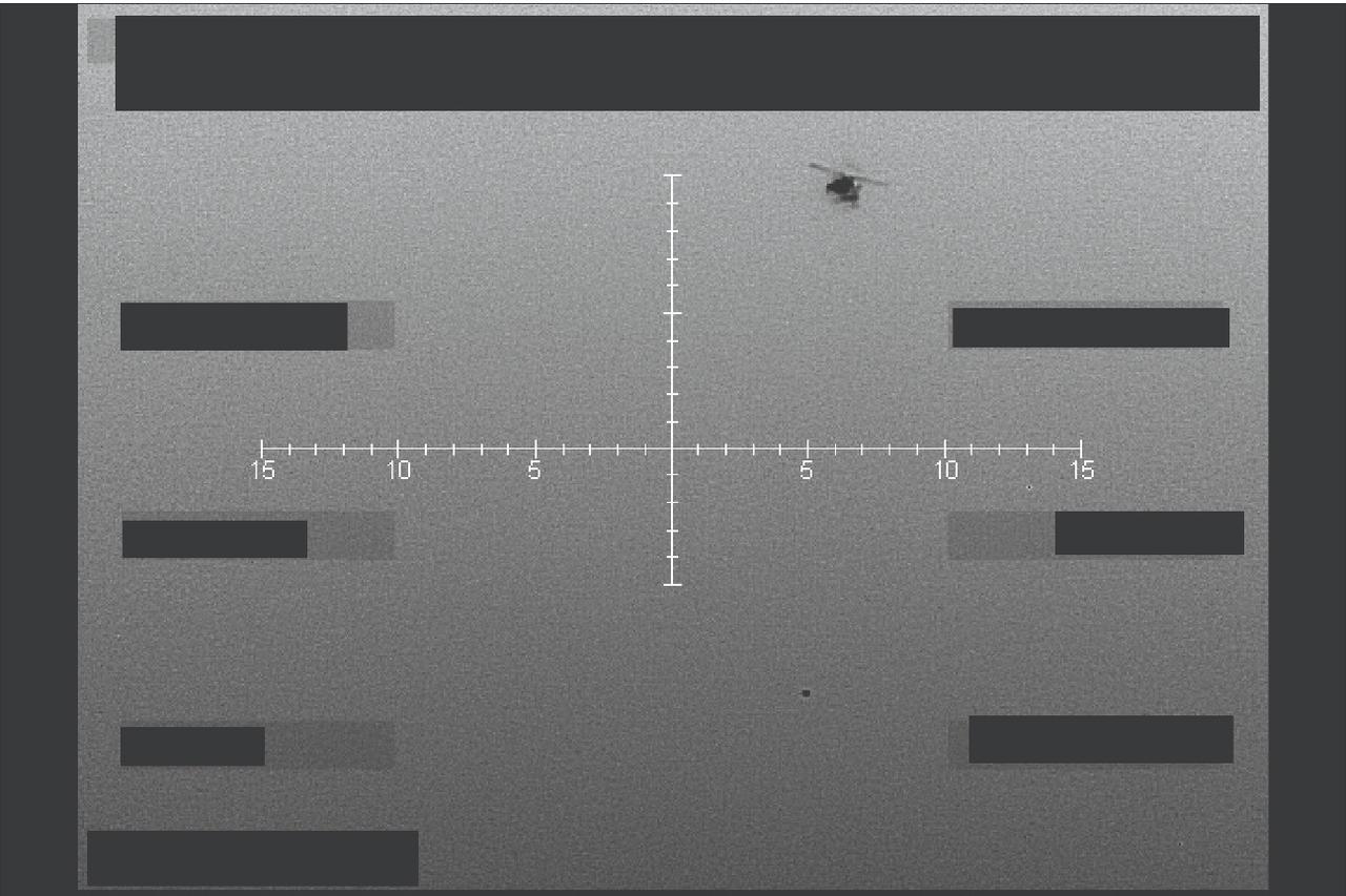 This handout image released by the US Department of Defense on May 8, 2026, shows what the Department of Defense and FBI say is an infrared still image (black hot) captured of unidentified object below helicopter over western United States in September, 2025.