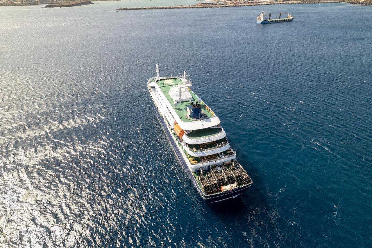 This aerial picture shows a general view of the cruise ship MV Hondius stationary off the port of Praia, the capital of Cape Verde, on May 3, 2026. (AFP Photo)