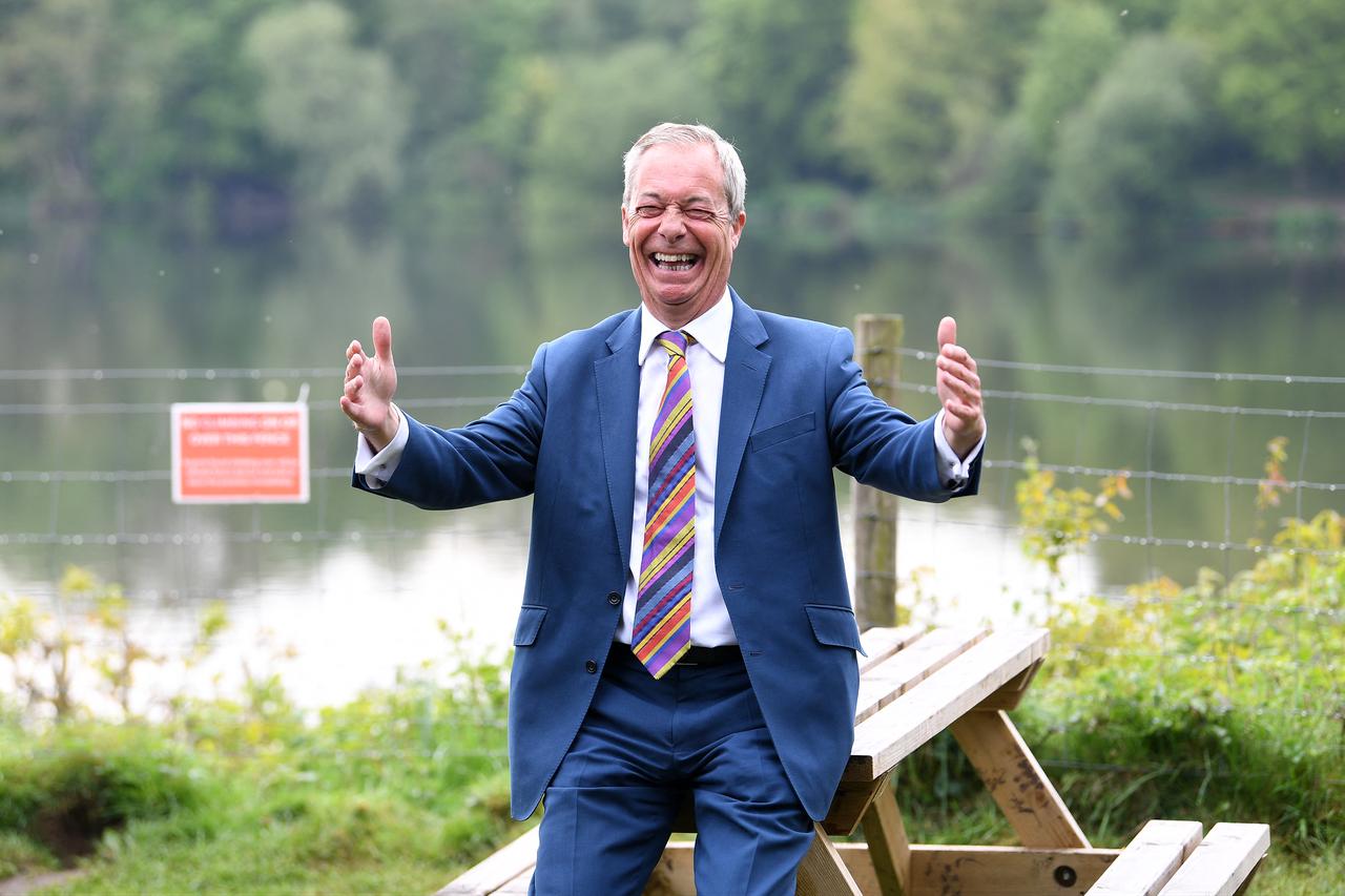 Reform UK leader Nigel Farage reacts during a visit to St Helens, north west England on May 8, 2026, as votes continue to be counted following local elections. (AFP photo)