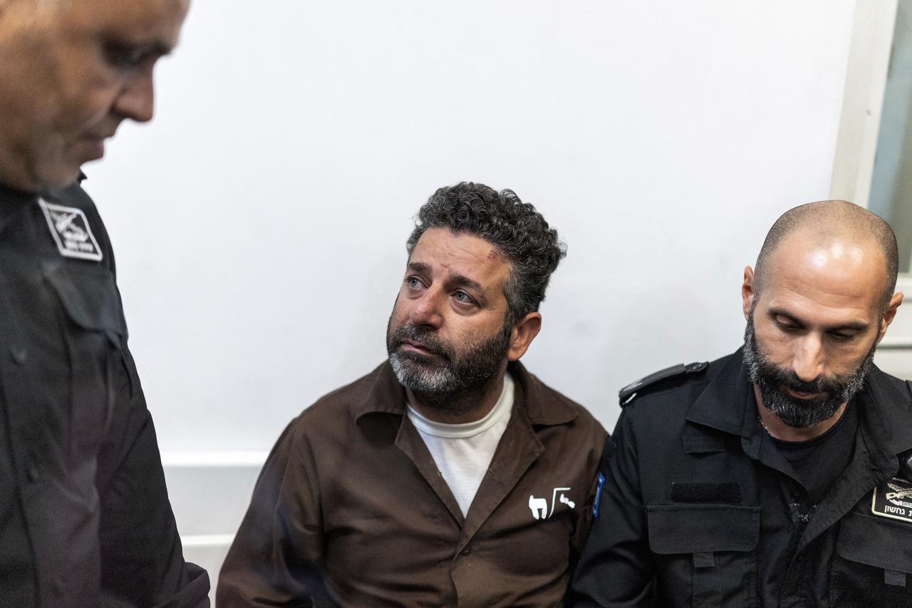 Israeli officers bring Spanish activist Saif Abu Keshek to a court in Ashkelon on May 5, 2026. (AFP Photo)