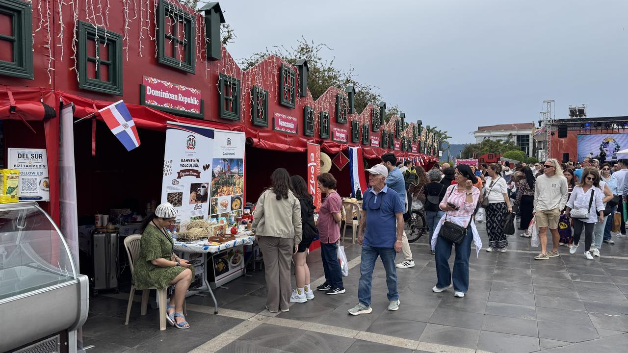 Visitors walk through food and culture stalls representing Latin American countries at Marmaris Latin Fest in Mugla, Türkiye, May 8, 2026. (AA Photo)