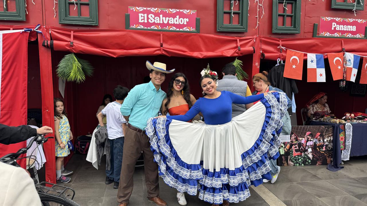 Festival participants pose in traditional dress in front of national stands at Marmaris Latin Fest, highlighting Latin American culture and heritage in Mugla, Türkiye, May 8, 2026. (AA Photo)