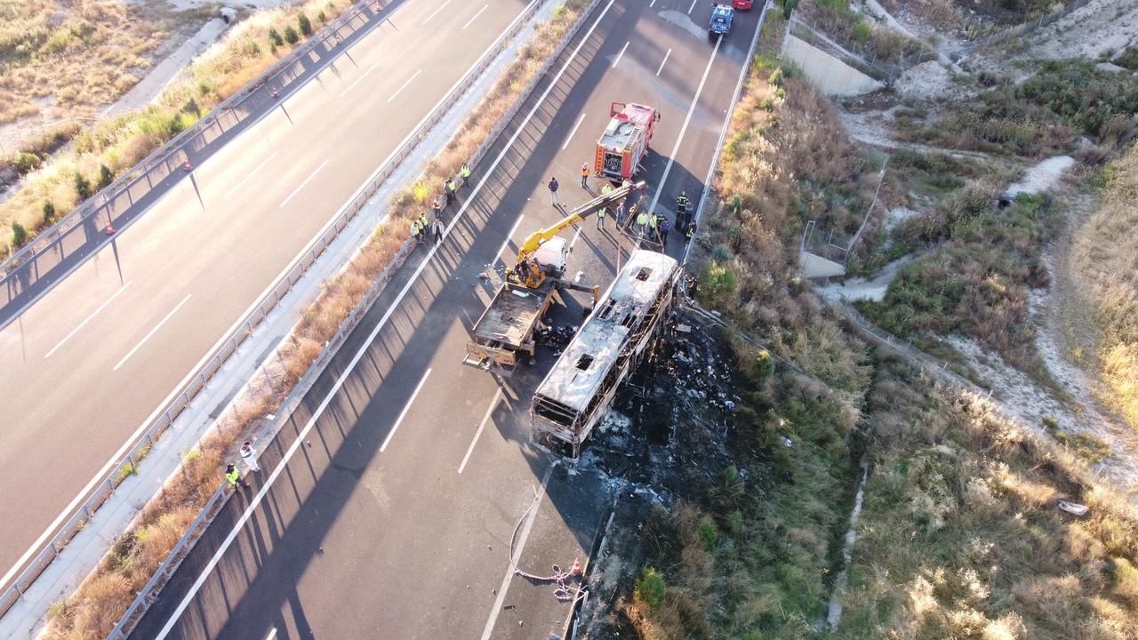 Aerial view shows the charred remains of a passenger bus after it crashed into roadside barriers and caught fire on the Denizli-Aydin Motorway near Saraykoy, Denizli province, western Türkiye, June 1, 2026. (AA Photo)