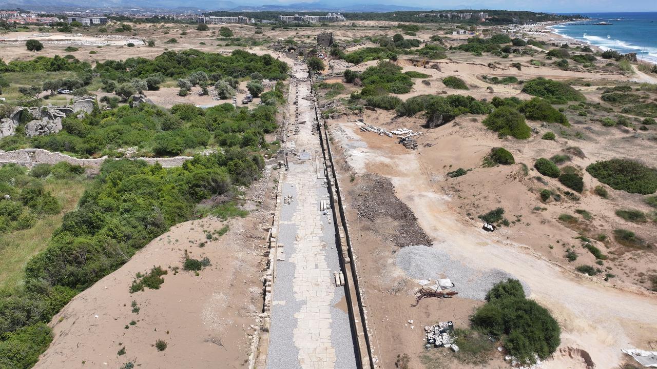 An aerial view shows an ancient street leading to the second main gate of the ancient city of Side after being unearthed in the Manavgat district of Antalya, Türkiye, May 21, 2026. (AA Photo)