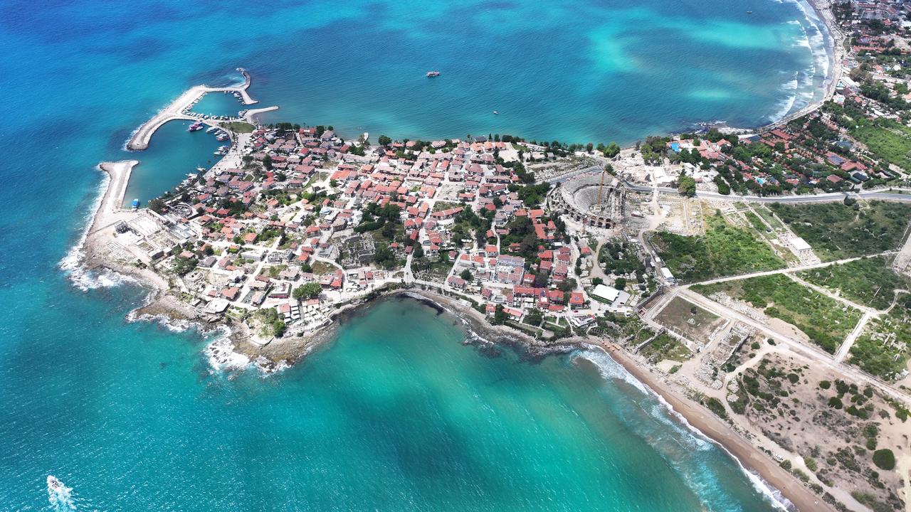 An aerial view shows an ancient street leading to the second main gate of the ancient city of Side after being unearthed in the Manavgat district of Antalya, Türkiye, May 21, 2026. (AA Photo)