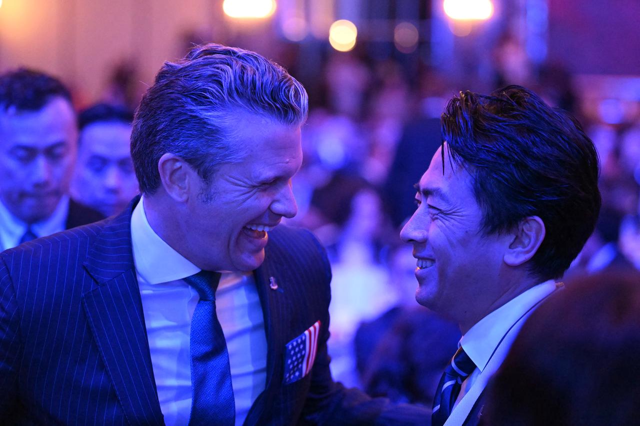 US Secretary of Defense Pete Hegseth (L) laughs with Japan's Defense Minister Shinjiro Koizumi during the 23rd Shangri-La Dialogue summit in Singapore, May 29, 2026. (AFP Photo)