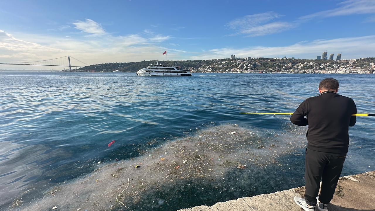 Waste and surface pollution are seen in the Bosphorus, with Istanbul’s coastline in the background, Türkiye. (IHA Photo)