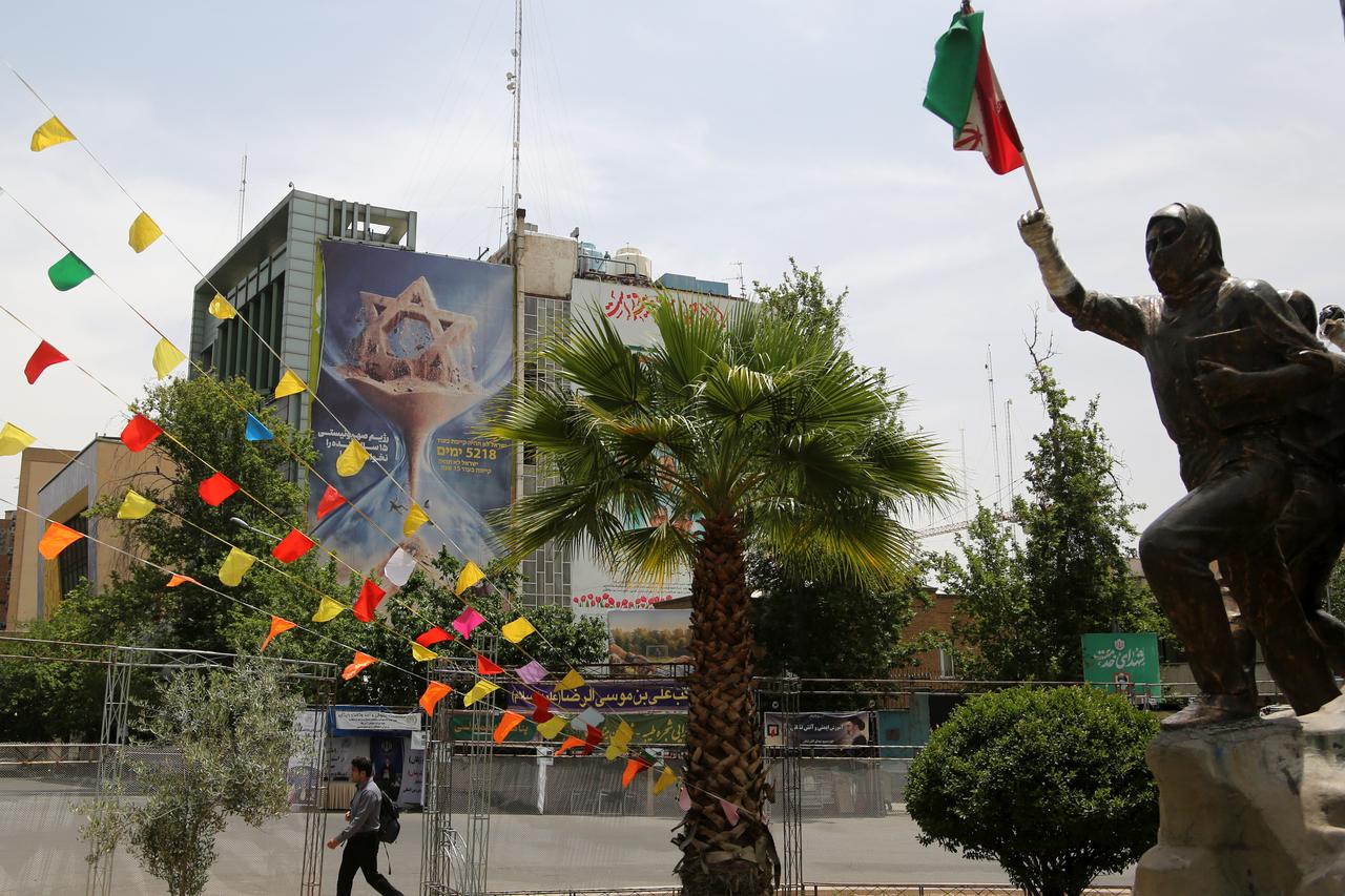 A view shows an anti-Israel billboard with an hourglass image and Persian and Hebrew text reading "Israel will not see the next 15 years" at Palestine Square in Tehran, Iran, on May 29, 2026. (AA Photo)