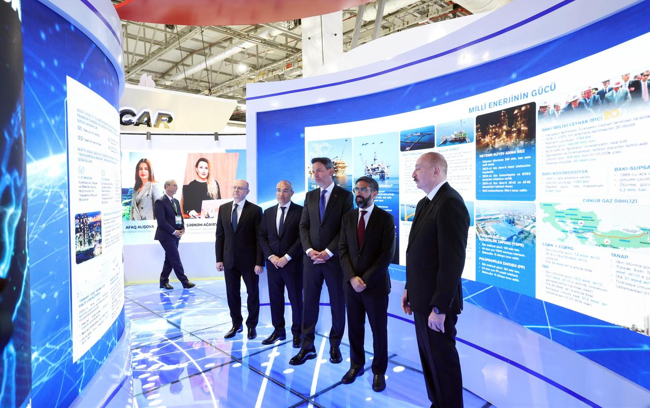 Azerbaijani President Ilham Aliyev (right) and Türkiye's Energy and Natural Resources Minister Alparslan Bayraktar (center) visit an exhibition during the opening of Baku Energy Week in Baku, Azerbaijan, June 1, 2026. (AA Photo)