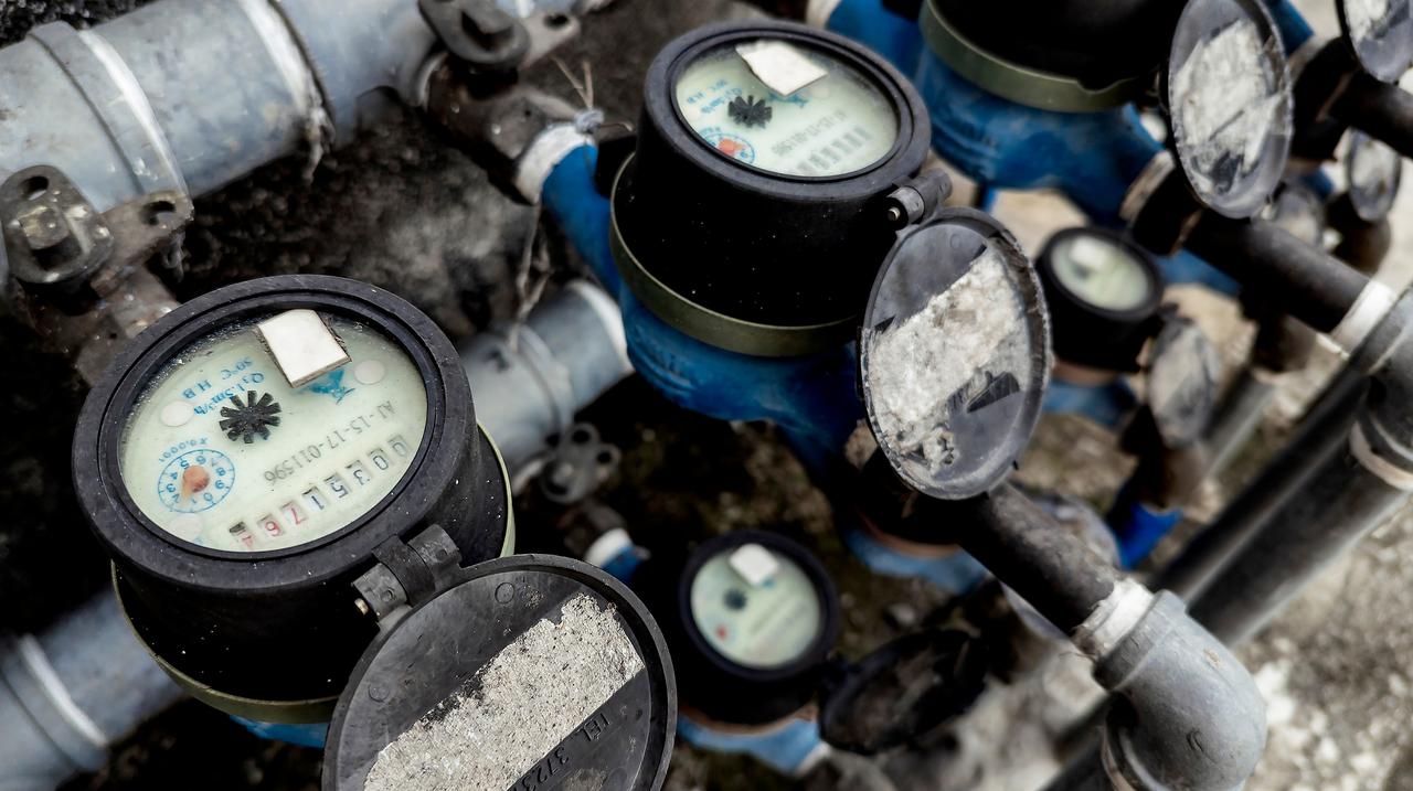 Water meters and pipes are seen. (Adobe Stock Photo)