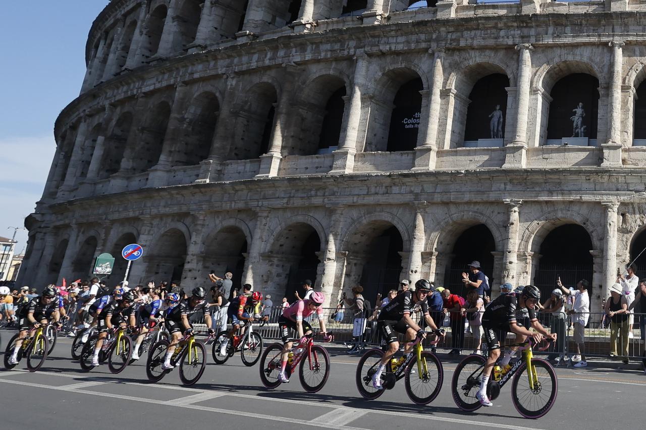 Denmark's Jonas Vingegaard (C) and other athletes make their way past the Colosseum during the 21st and last stage of the Giro d'Italia (Tour of Italy) cycling race 109th edition in Rome, Italy, May 31, 2026. (AA Photo)