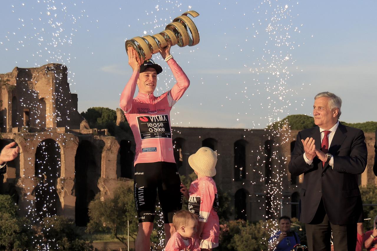 Denmark's Jonas Vingegaard (L), winner of the Giro d'Italia (Tour of Italy) cycling race 109th edition, is congratulated by Italian Foreign minister Antonio Tajani (R) as he attends the award ceremony with his children at the end of the 21st and final stage in Rome, Italy, May 31, 2026. (AA Photo)