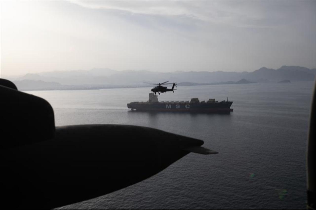 US Army AH-64 Apaches fly above the Strait of Hormuz during a patrol, on April 17, 2026. (Photo via X/@CENTCOM)
