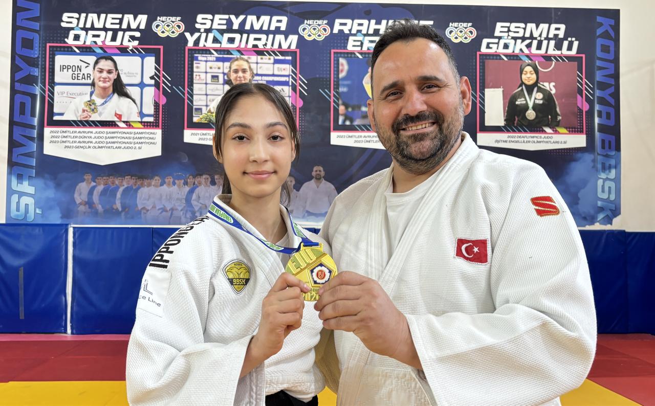 Turkish judoka Havva Sena Tokmak poses with her coach Hakan Aydogan after her European Cup gold medal success in Portugal. (AA Photo)