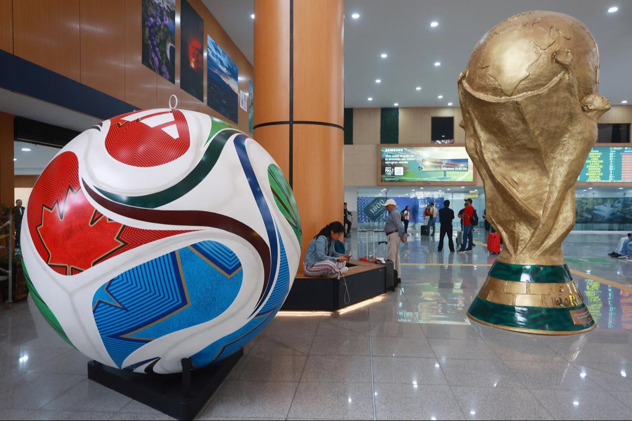 Figures representing the FIFA World Cup trophy and the official match ball, Trionda, created by Mexican artisans, are displayed at Benito Juarez International Airport, in Mexico City, Mexico, May 29, 2026. (AA Photo)