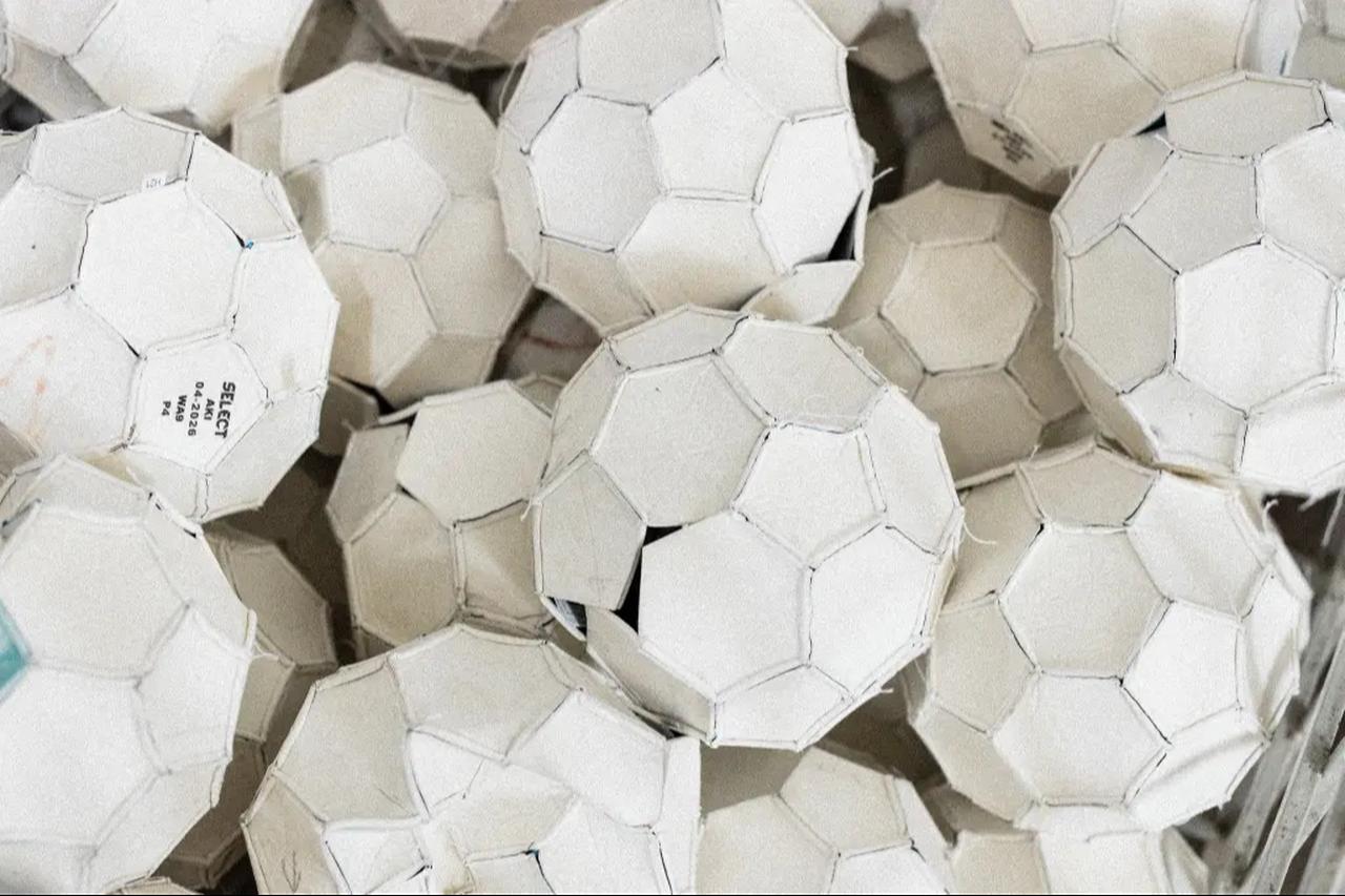 Around 300,000 hand-stitched balls leave the factories every day. (Photo via Stefan Bohrer/SWNS)