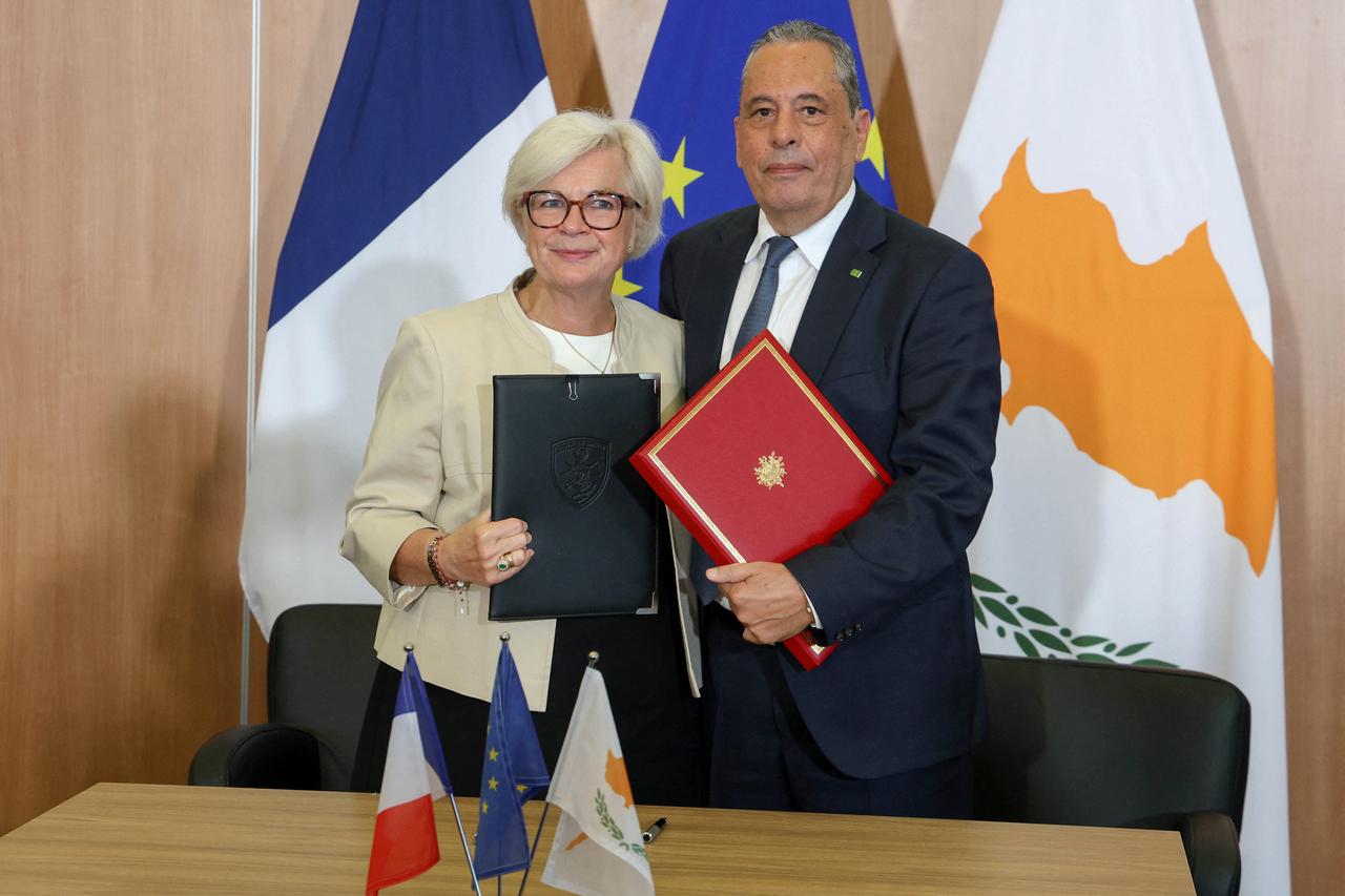 France's Defense Minister Catharine Vautrin and her Greek Cypriot counterpart Vasilis Palmas pose for a picture after signing a Status of Forces Agreement (SOFA) in Nicosia on June 8, 2026. (Photo by Spiros  GIAGKOU/Cyprus Presidency of the Council of the EU 2026 /AFP)
