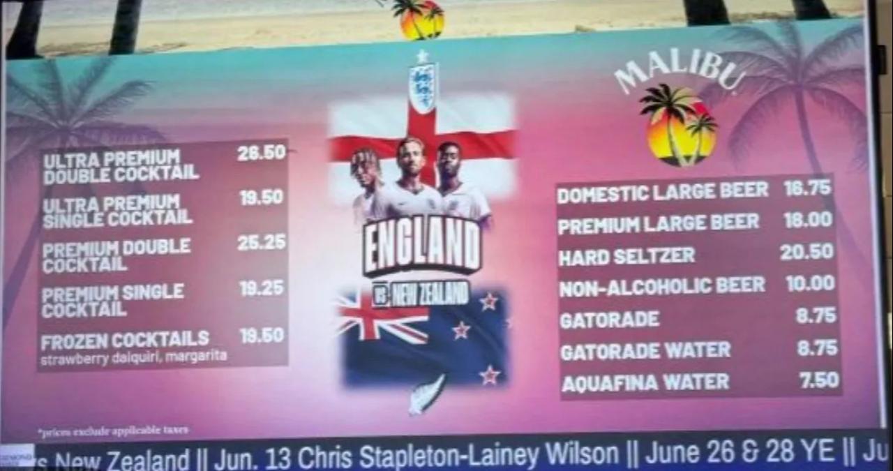 A stadium drinks menu for an England-New Zealand match shows high prices for cocktails, beer, sports drinks and bottled water, June 2026. (Photo via The Sun)