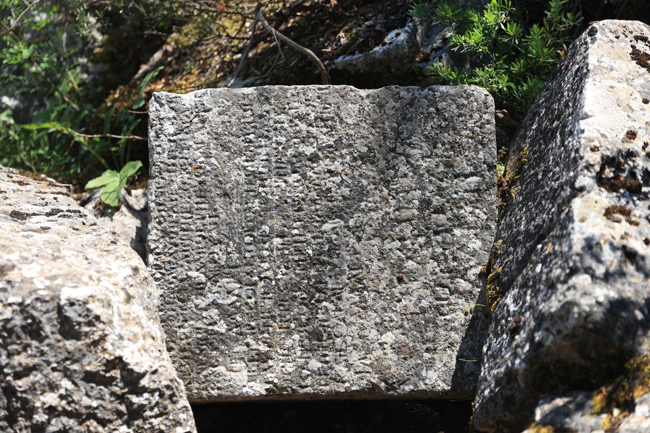 An inscription block linked to ancient divination practices at Termessos in Antalya, southern Türkiye. (AA Photo)