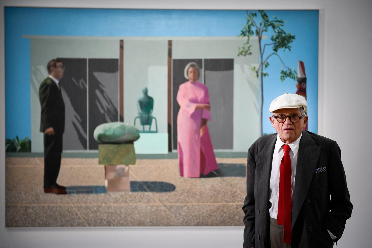 British artist David Hockney poses in front of his painting "Fred and Marcia Weisman" during a photo session at the Pompidou Centre in Paris, on June 16, 2017.(AFP Photo)