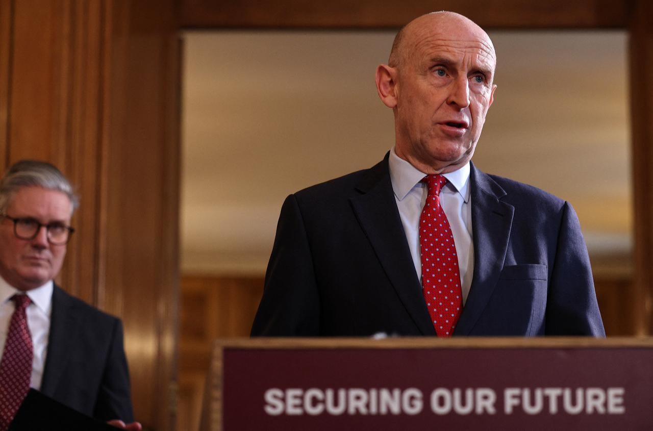 Britain's Prime Minister Keir Starmer (L) listens as Britain's Defense Secretary John Healey, during a careers fair inside 10 Downing Street in central London, March 3, 2025. (AFP Photo)