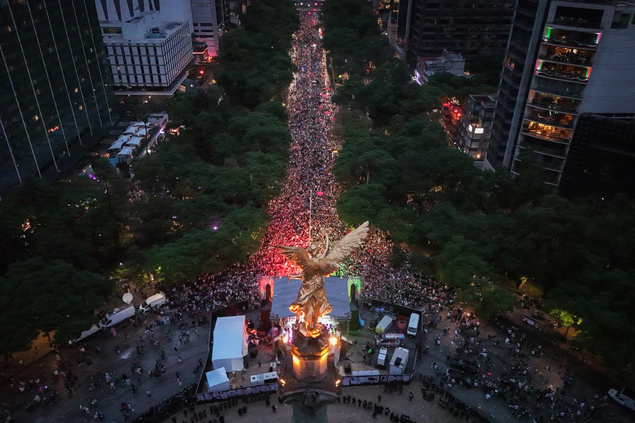 Thousands of Mexican fans gather at the iconic Angel of Independence monument to celebrate Mexico's victory over South Africa. (AA Photo)