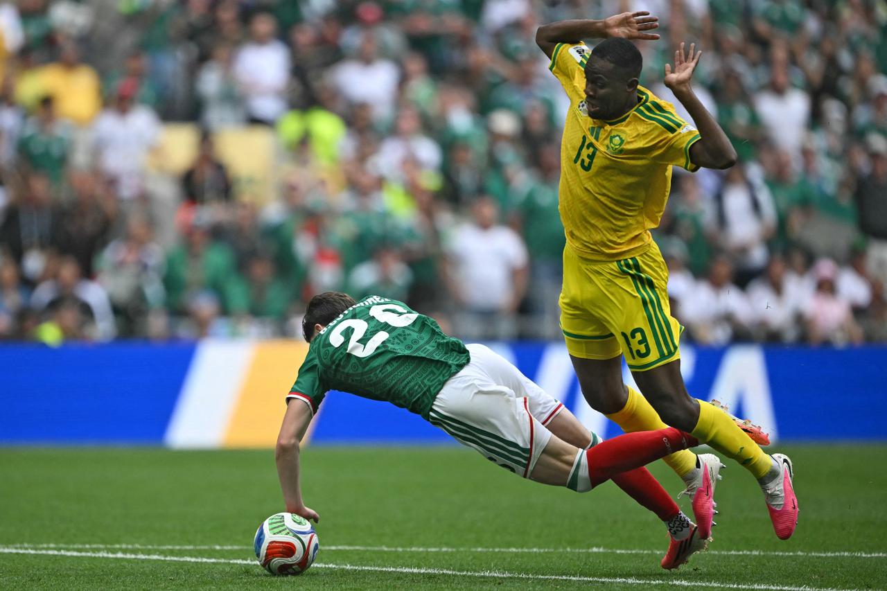 Mexico's midfielder #26 Brian Gutierrez is fouled by South Africa's midfielder #13 Sphephelo Sithole during the 2026 World Cup Group A football match between Mexico and South Africa at the Mexico City Stadium in Mexico City on June 11, 2026. (AFP Photo)