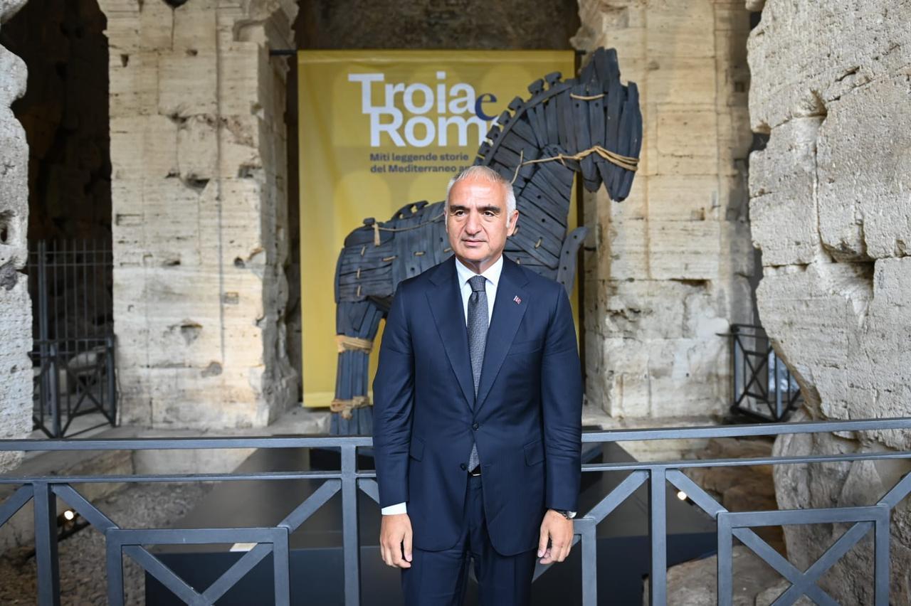 Turkish Culture and Tourism Minister Mehmet Nuri Ersoy poses in front of the Trojan Horse installation at the “Troy and Rome” exhibition in Rome, Italy, June 11, 2026. (Photo via Turkish Culture and Tourism Ministry)