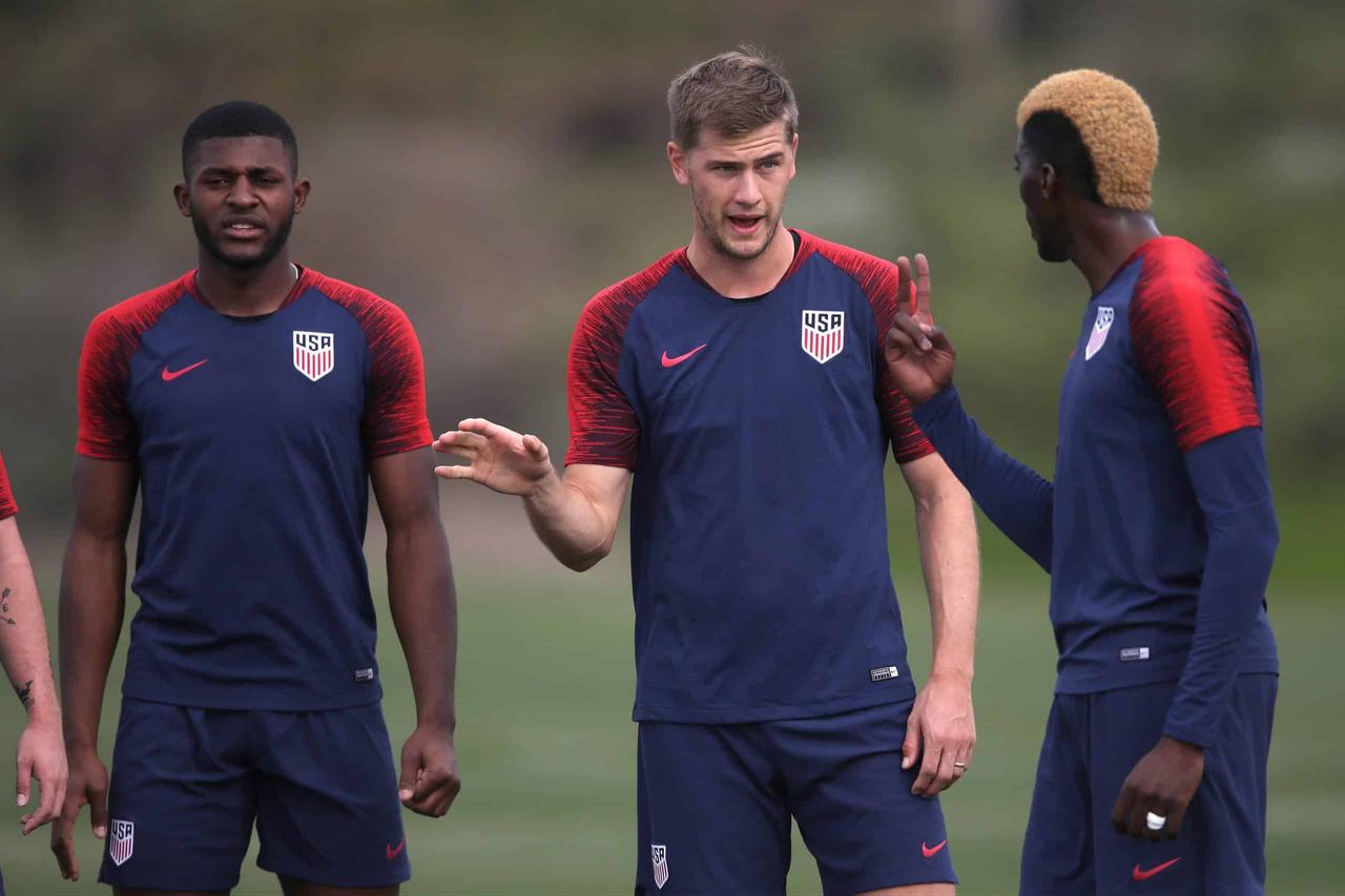 (L-R) Mark McKenzie, Tyler Miller and Gyasi Zardes of the United States Men's National Soccer Team discuss a play during training at the U.S. Olympic and Paralympic Training Site on January 11, 2019 in California, United States (AFP Photo)